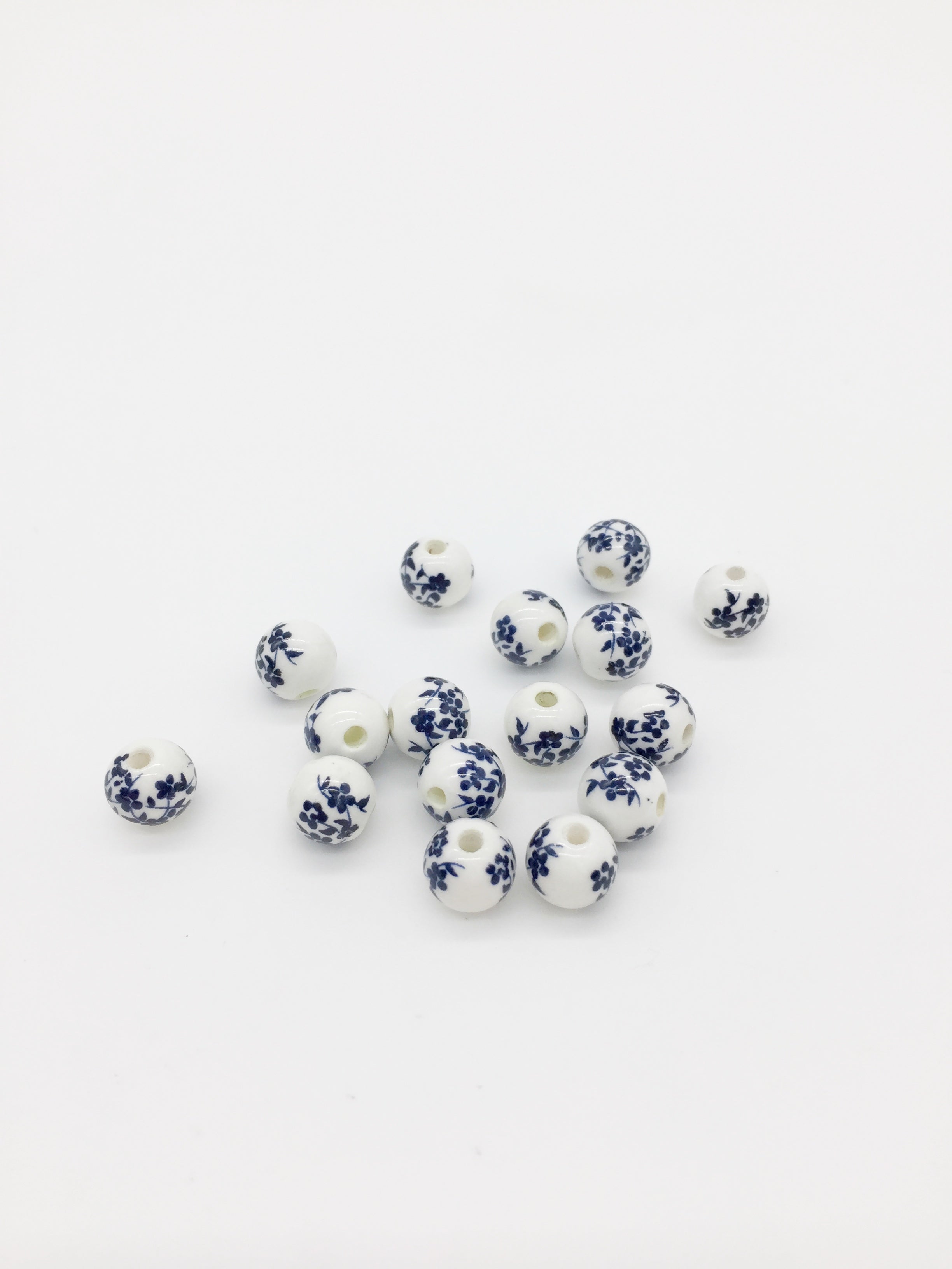 10 x Round White Ceramic Beads with Navy Blue Floral Pattern, 8mm (3875)