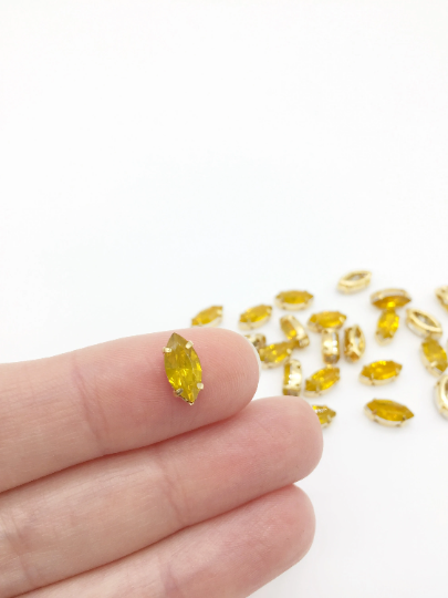 24 x 5x10mm Navette Yellow Opal Rhinestones in Gold Tone Sew-on Setting (3832)