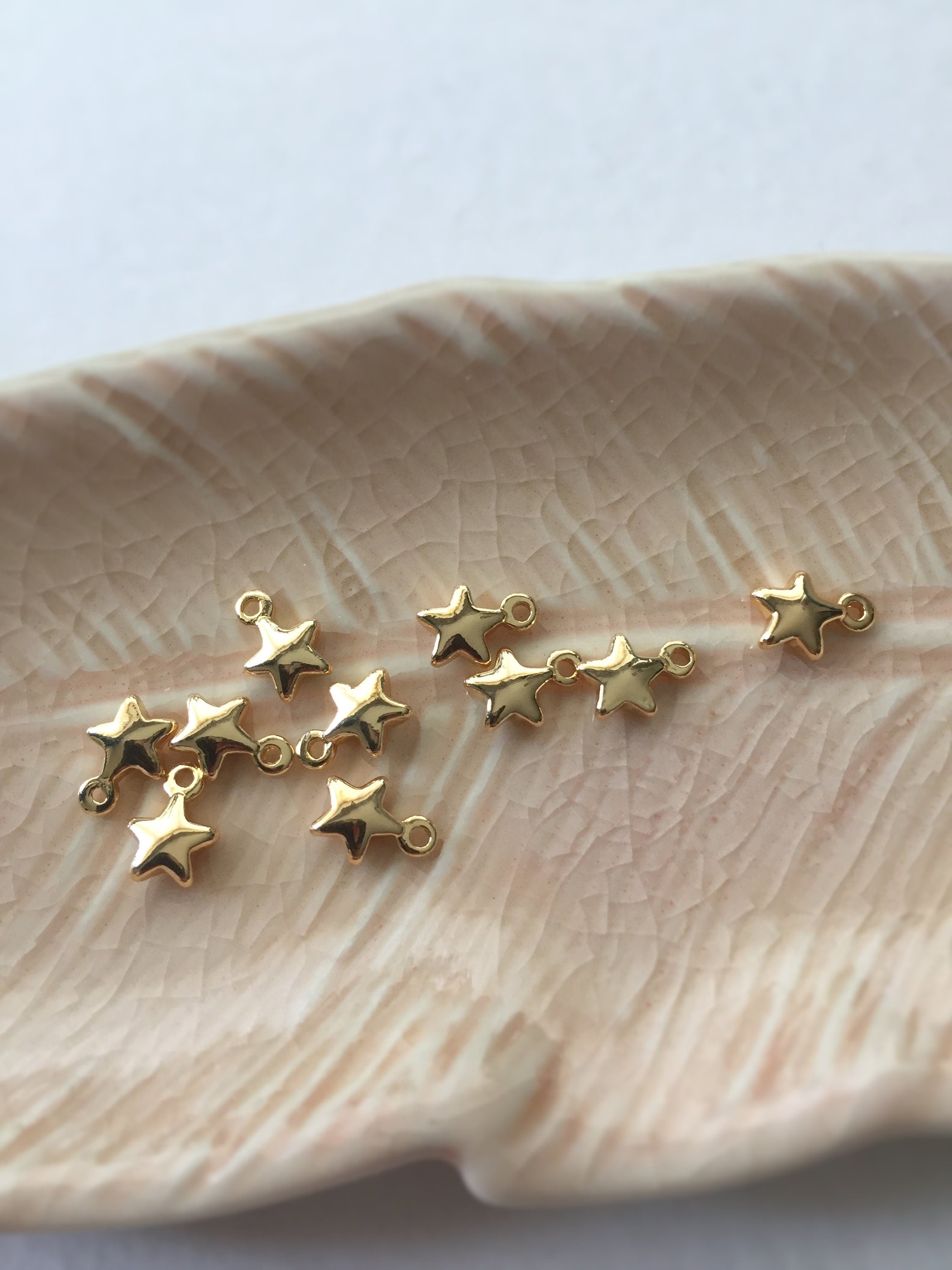 12 x Gold Plated Tiny Brass Star Charms 7.5x5.5mm (0159)