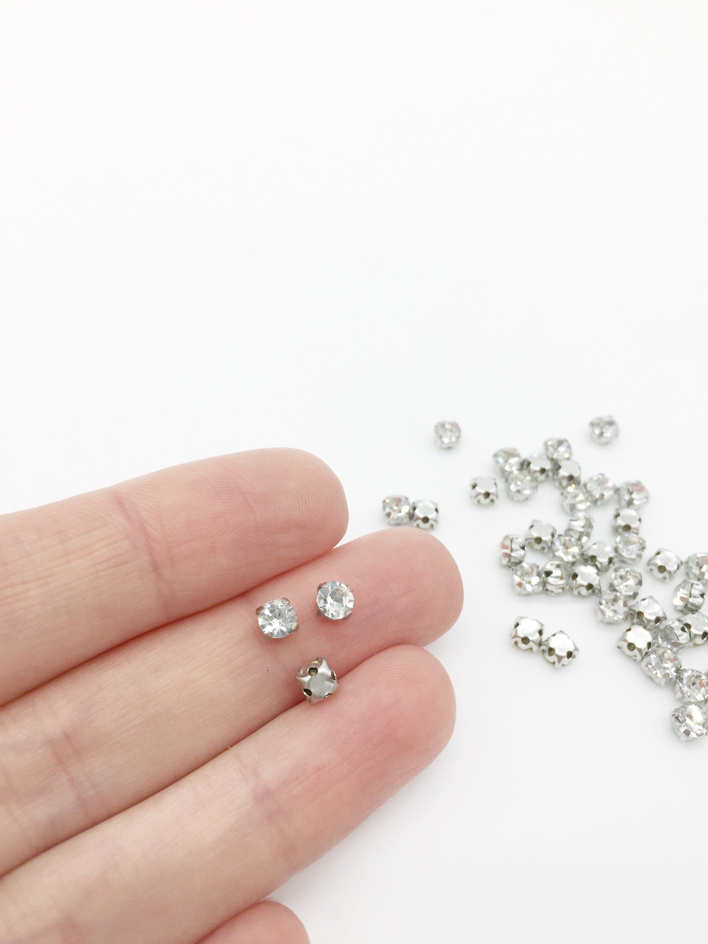 72 x Clear Crystal Sew On Rhinestones in Rhodium Base, 4.3mm, 4mm or 3.7mm (3359)