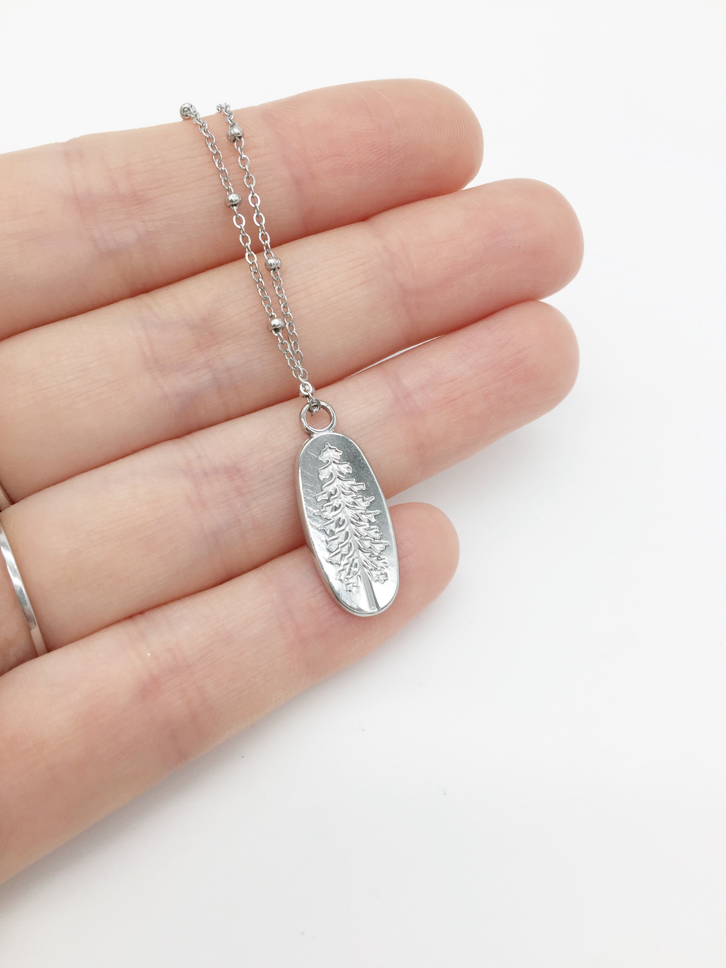 1 x Stainless Steel Oval Pendant with Embossed Pine Tree Pattern, 24x10mm (0126S)