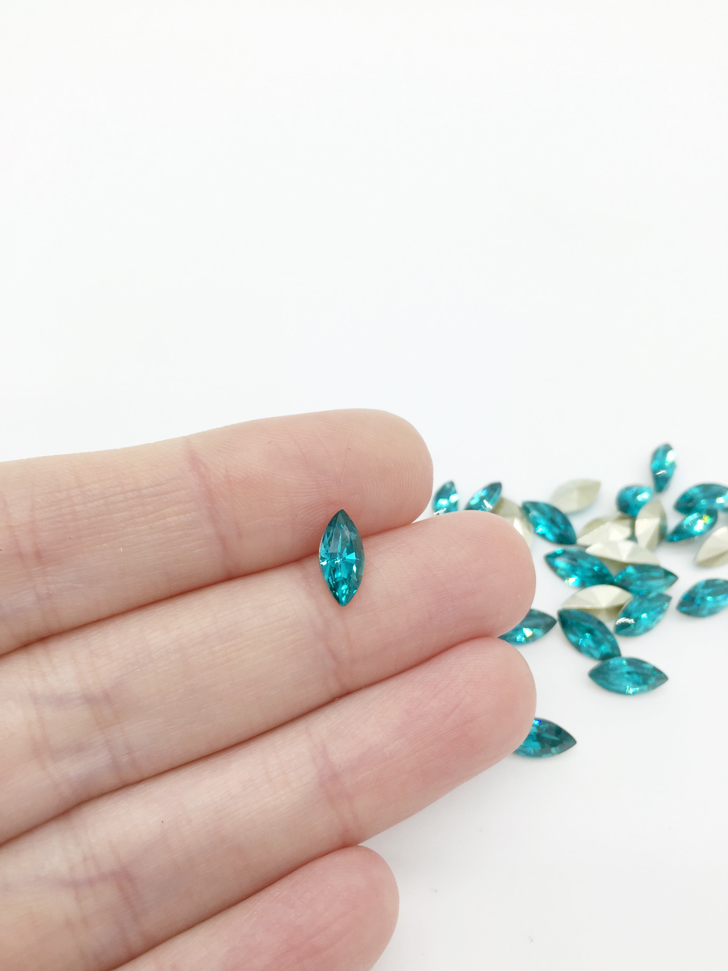 24 x 5x10mm Sea Blue Crystal Navette Rhinestones, Foiled Back (4085)