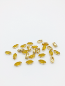 24 x 5x10mm Navette Yellow Opal Rhinestones in Gold Tone Sew-on Setting (3832)