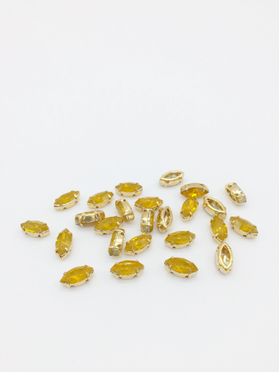 24 x 5x10mm Navette Yellow Opal Rhinestones in Gold Tone Sew-on Setting (3832)
