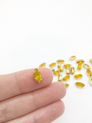 24 x 5x10mm Navette Yellow Opal Rhinestones in Gold Tone Sew-on Setting (3832)
