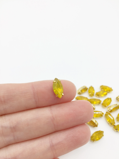 12 x 6x12mm Navette Yellow Opal Rhinestones in Gold Tone Sew-on Setting (3833)