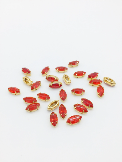 24 x 5x10mm Marquise Cut Red Opal Rhinestones in Gold Tone Sew-on Setting (3840)