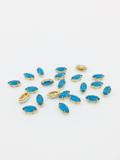 24 x 5x10mm Blue-green Opal Navette Rhinestones in Gold Tone Sew-on Setting (3844)