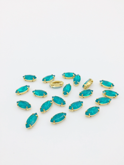 12 x 6x12mm Blue-green Opal Navette Rhinestones in Gold Tone Sew-on Setting (3845)