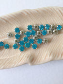 48 x Aquamarine Glass Rhinestones in Silver Sew-on Setting, 4mm or 5mm