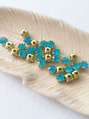 48 x Aquamarine Glass Rhinestones in Gold Sew-on Setting, 4mm or 5mm