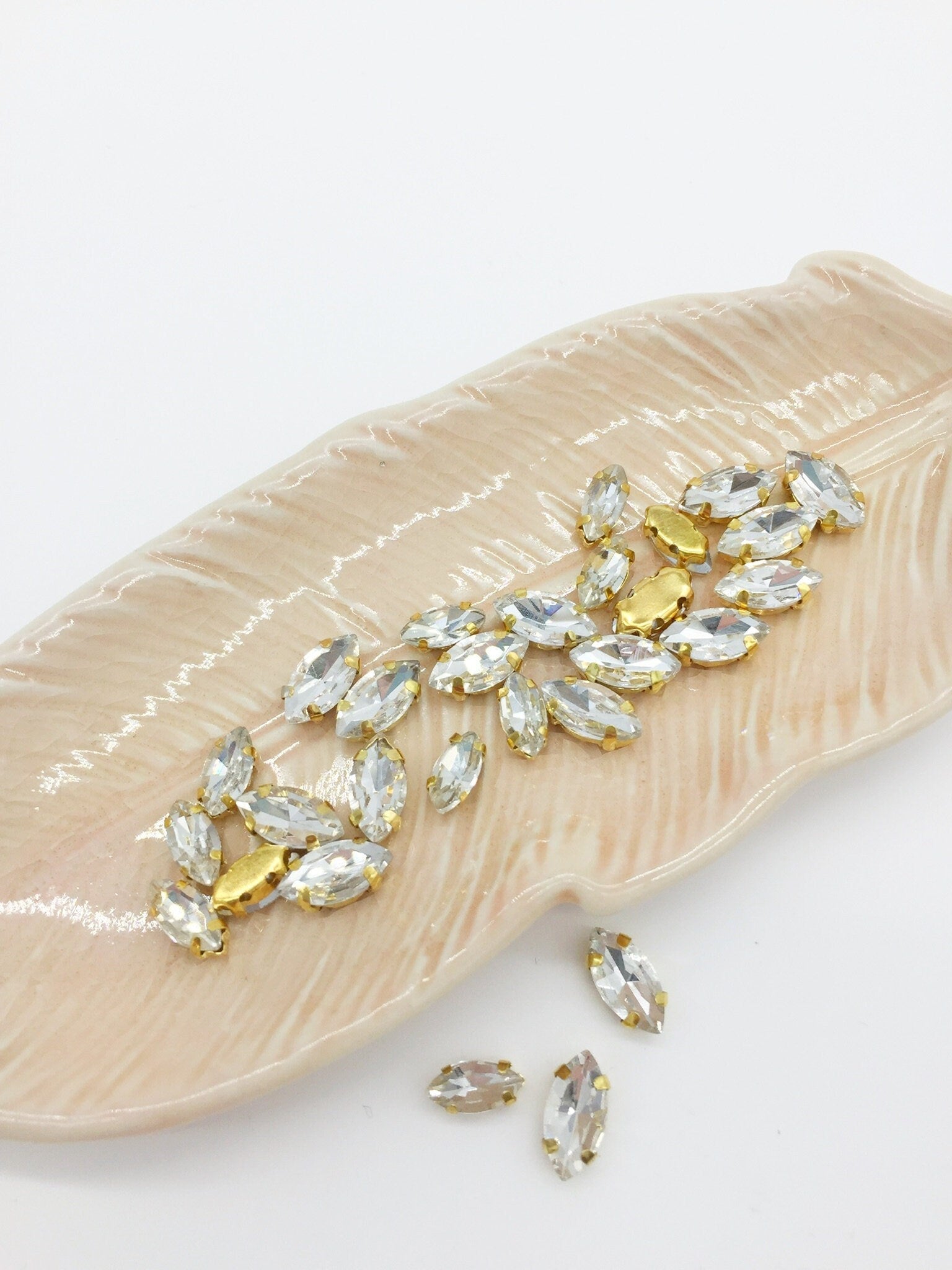 24 x 4x8mm Gold Navette Glass Rhinestones with Sew-on Base (2787)